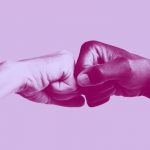 two hands fist-bumping