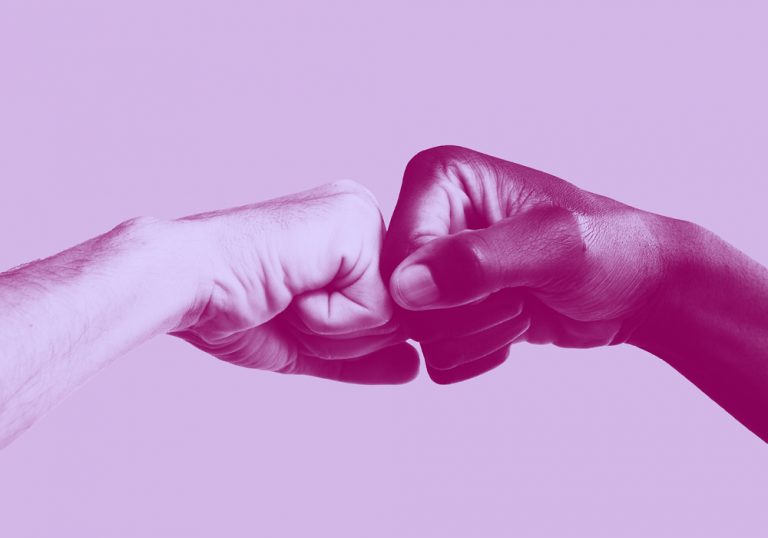 two hands fist-bumping