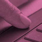 finger pushing space bar button on a keyboard, pink filter