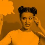 young woman holding up a thinking bubble and looking confused, orange fulter.