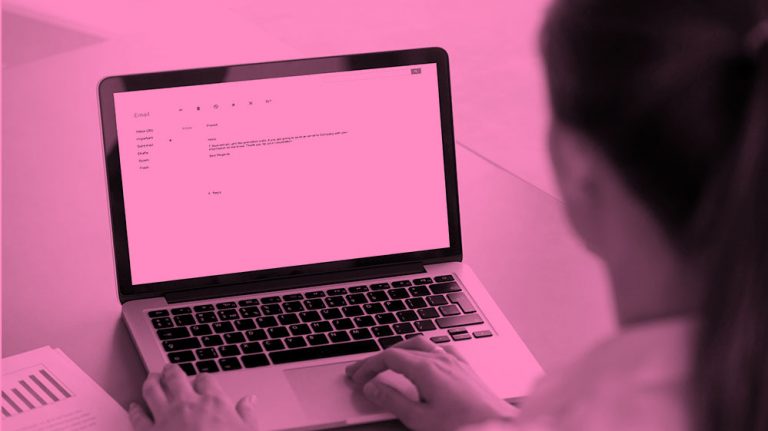 image of woman writing an email, in a pink filter.