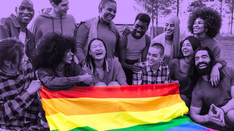 A diverse group of friends holding a rainbow pride flag, image in purple filter except for flag (rainbow colors are brightly visible)