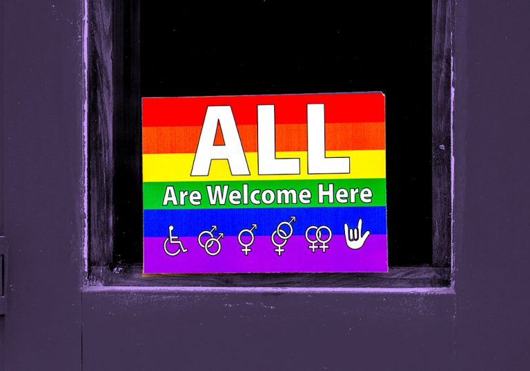 pride sign on door that read "All are welcome here"