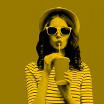 woman listening to music and enjoying a drink