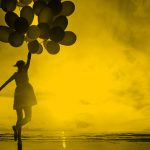 woman holding balloons