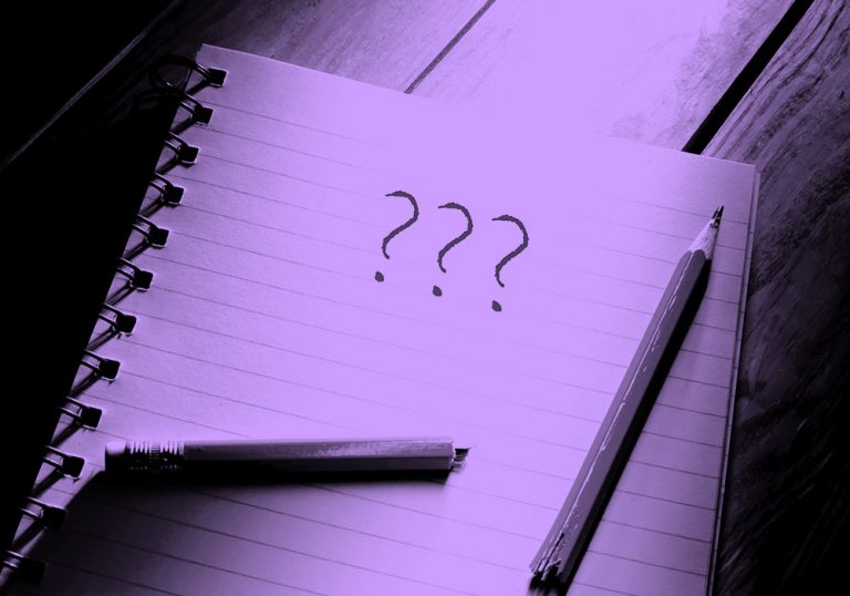 notebook with question marks, purple filter