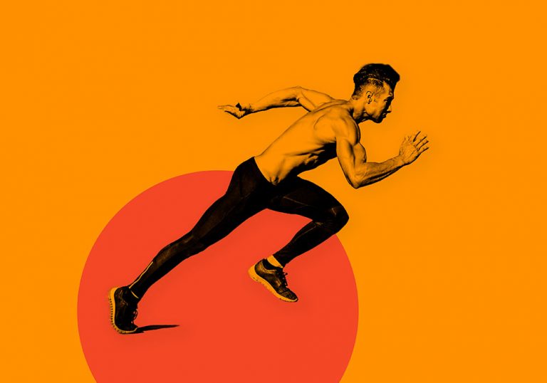 man sprinting on orange background
