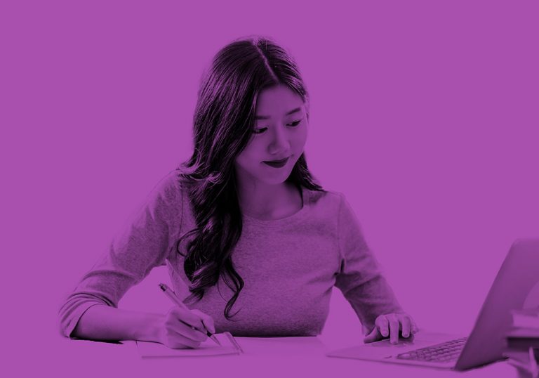 woman taking notes purple filter