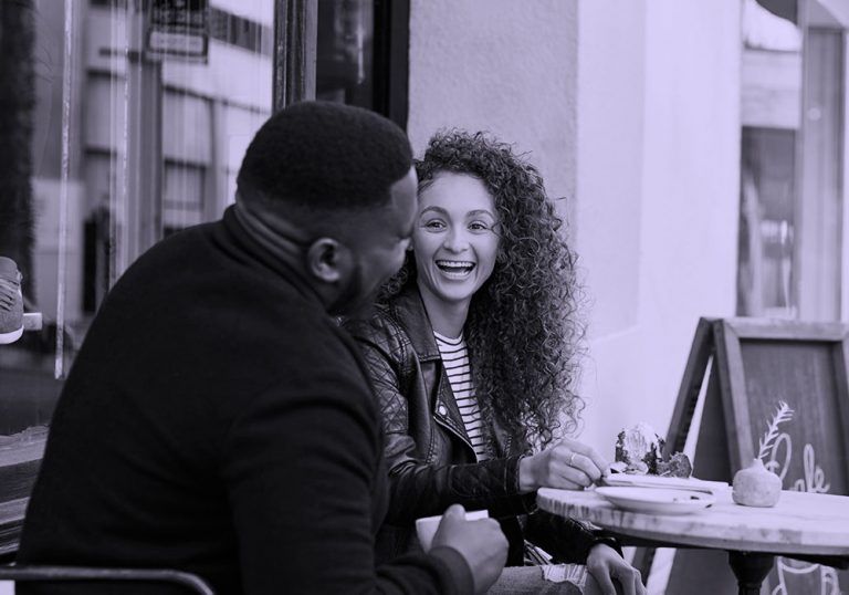 couple on date talking, purple filter