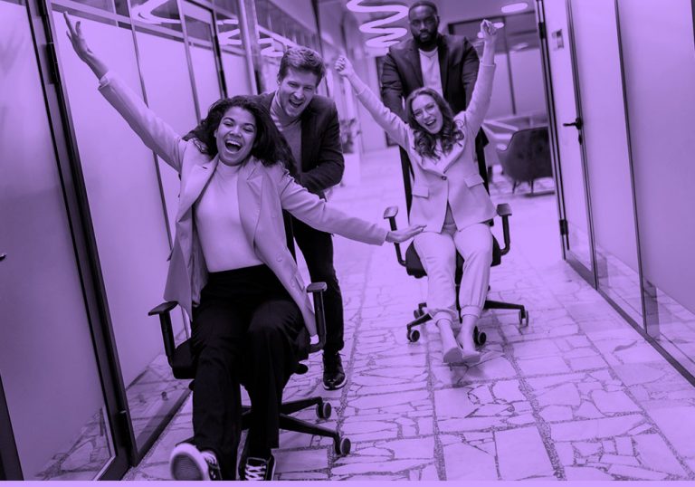 employees having fun at work, purple filter