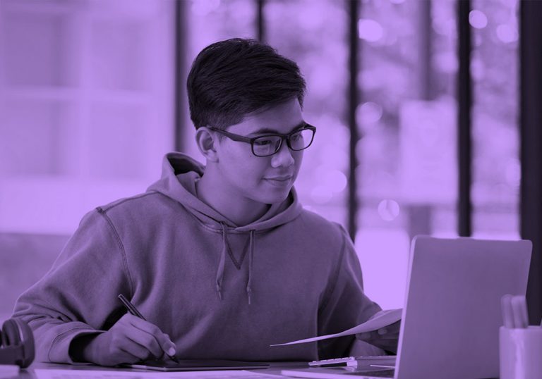 male student working on laptop, purple filter