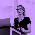 woman giving presentation, purple filter