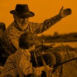 grandpa and grandson fishing; orange filter