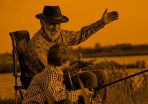 grandpa and grandson fishing; orange filter