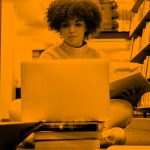 woman working on library floor; orange filter