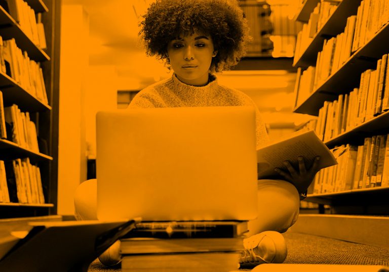 woman working on library floor; orange filter