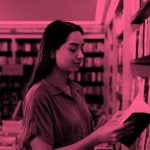 woman reading book in library; pink filter