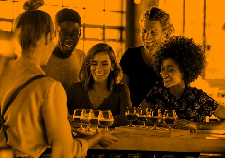 group of friends at bar; orange filter