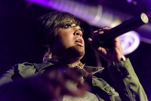 rapsody singing into microphone