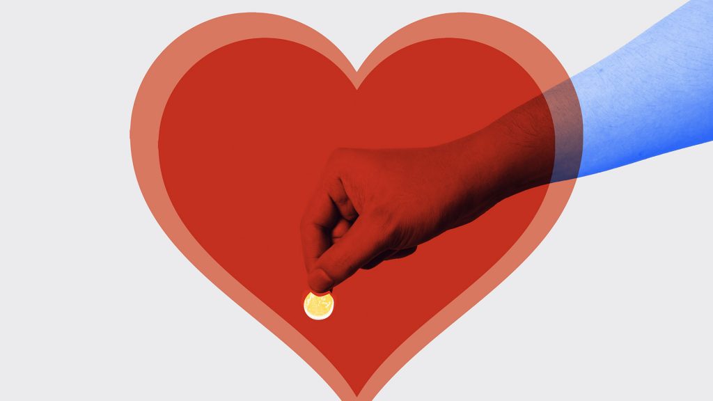 large read heart with hand holding coin